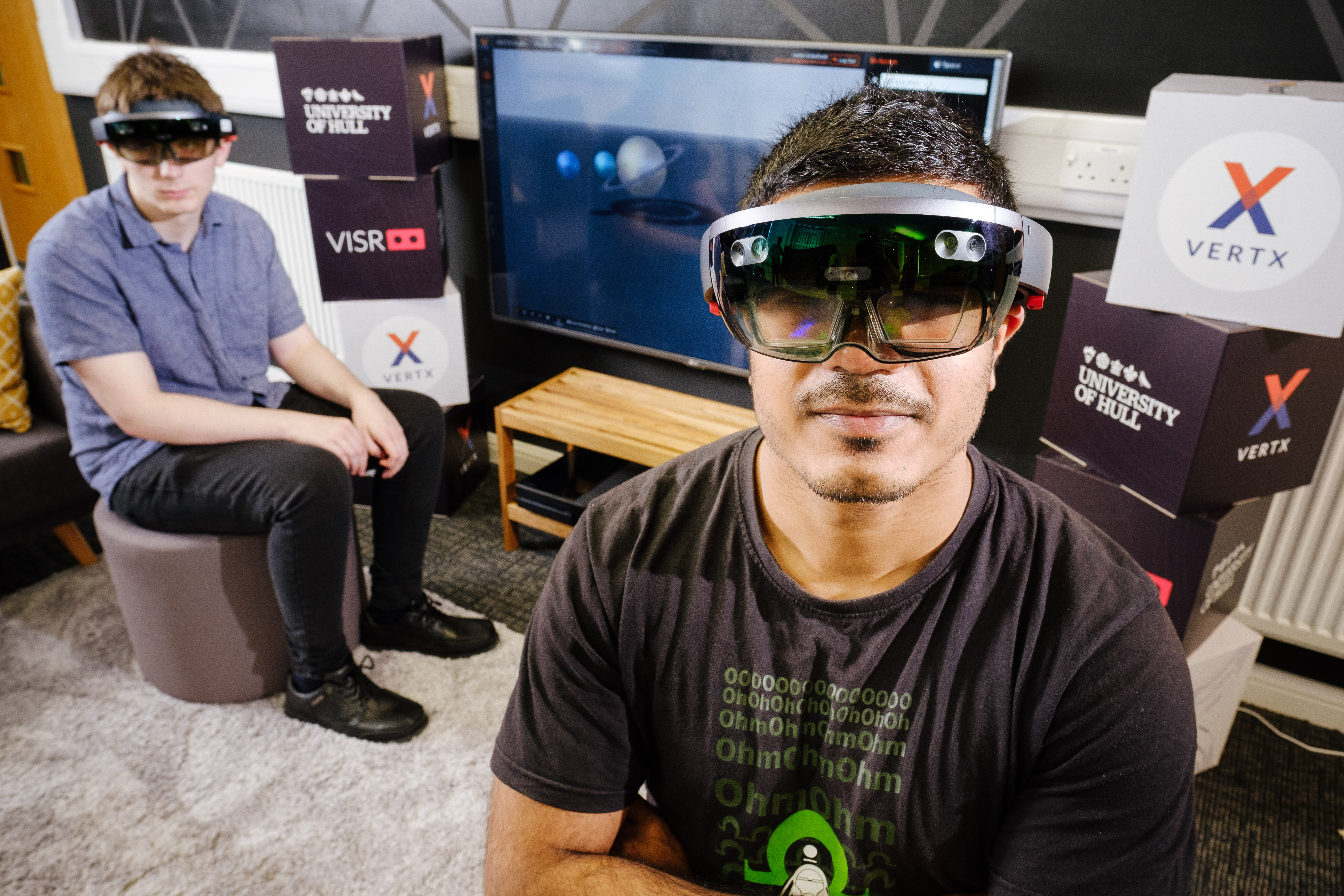 University of Hull Enterprise Centre, Kingston Upon Hull, East Yorkshire, United Kingdom, 18 June, 2018. Pictured: LtoR Josh Grierson, Arjun Chauhan, Students interacting with the HoloLens/VERTX technology being pioneered by the VISR.
