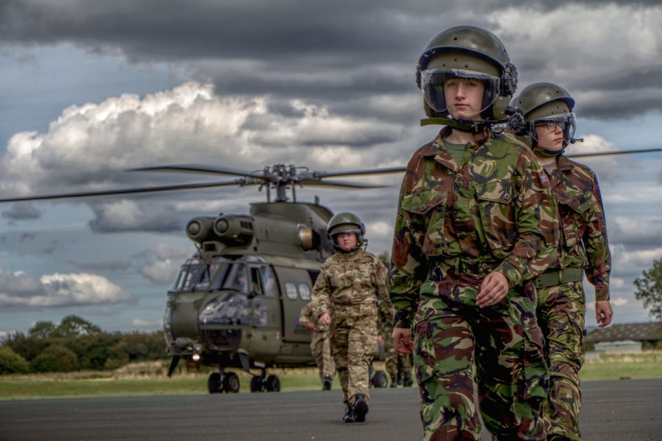 Air cadets walking away from a helicopter