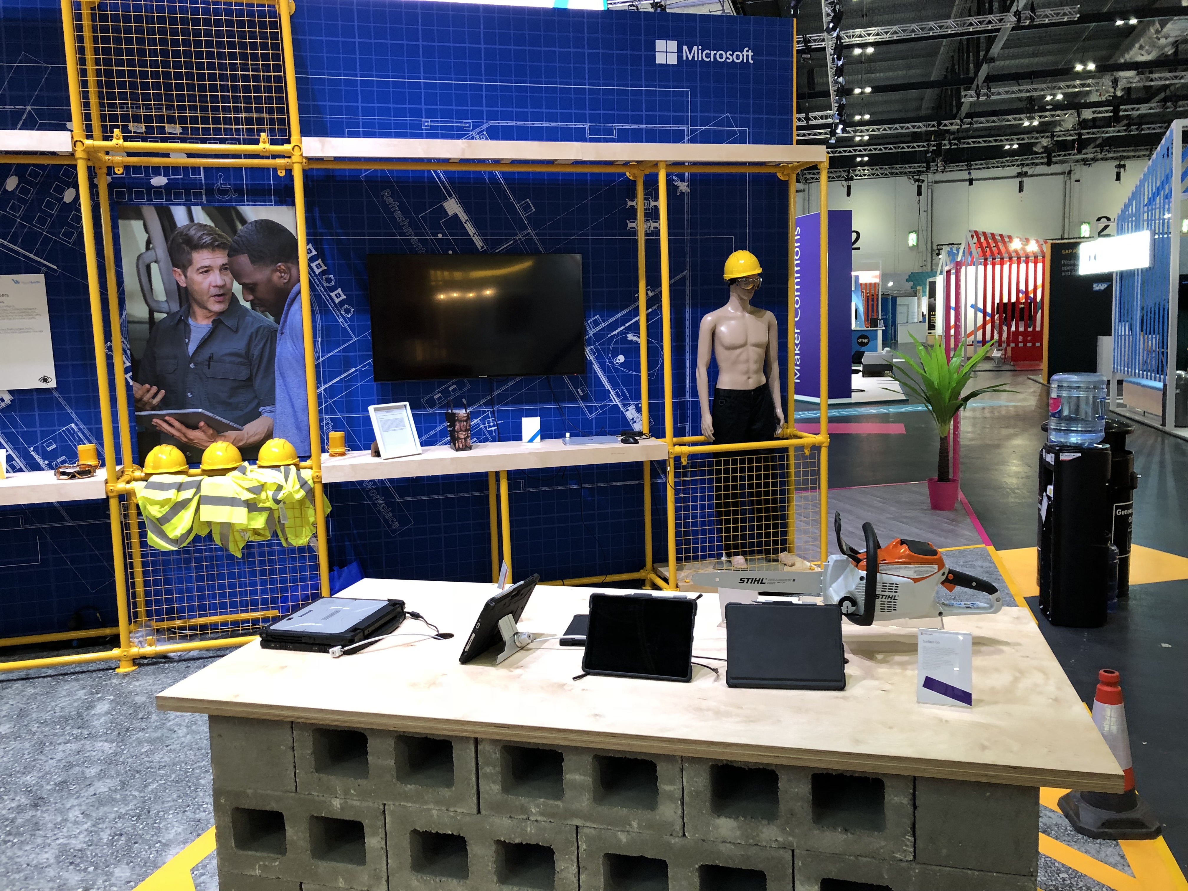 A stand showing how Microsoft helps the manufacturing and construction industries