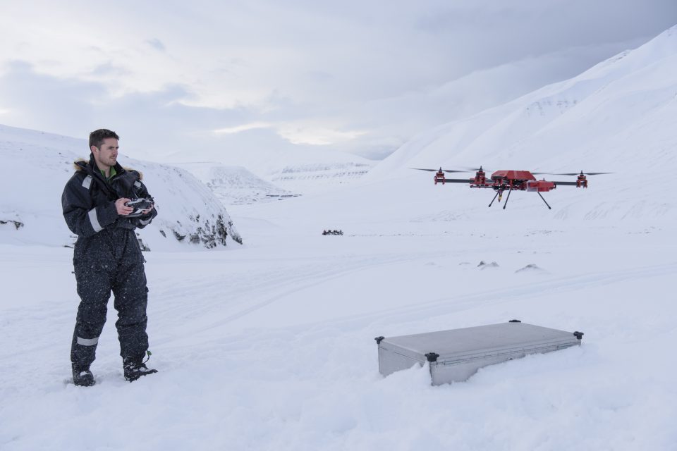 Scientist Joseph Cook flies a drone in the Arctic