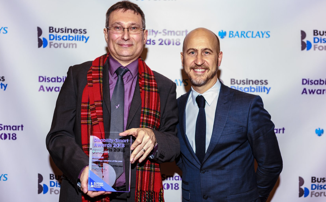 Hector Minto, right, and Michael Vermeersch collect the award