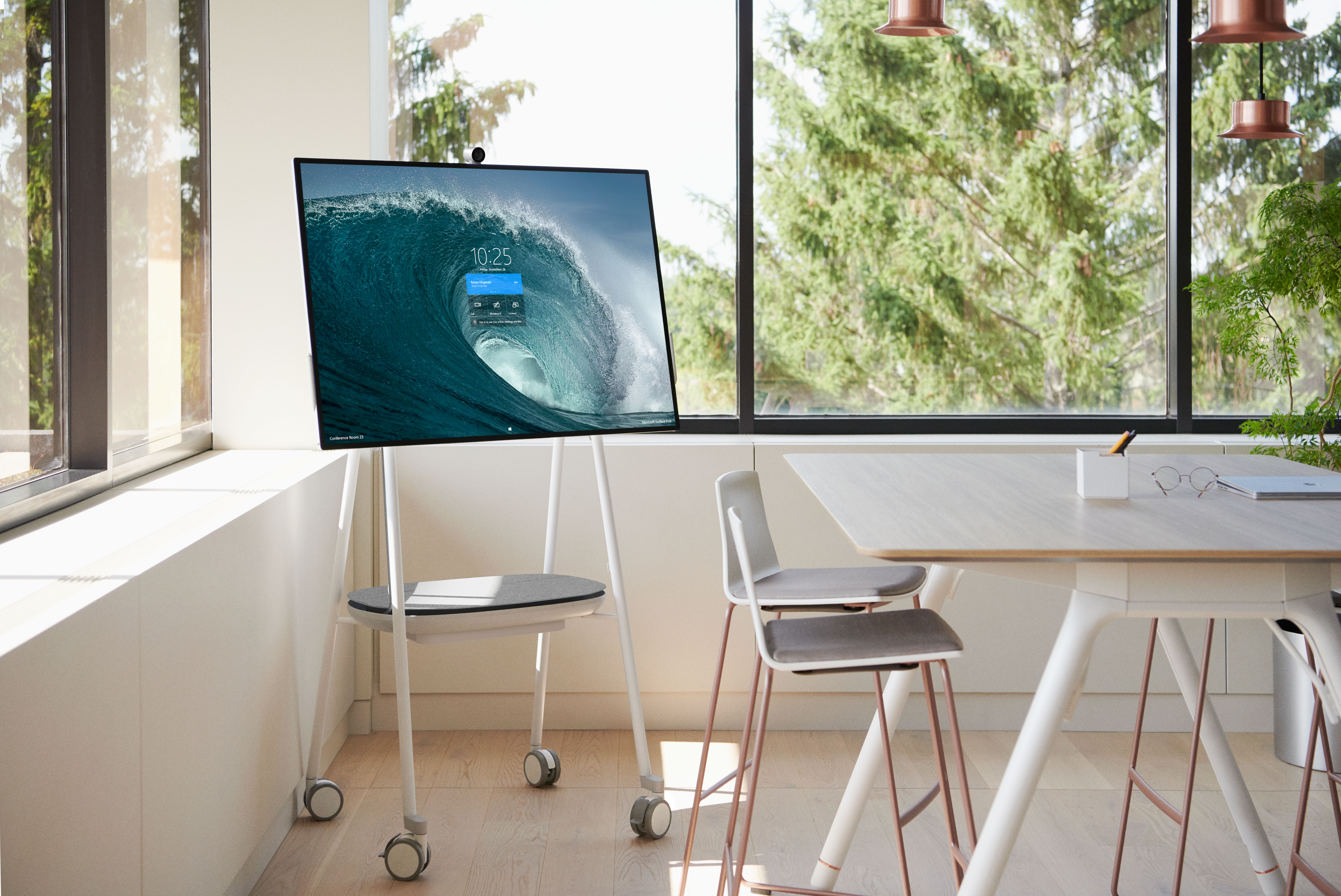 A Surface Hub 2S in the corner of an office room