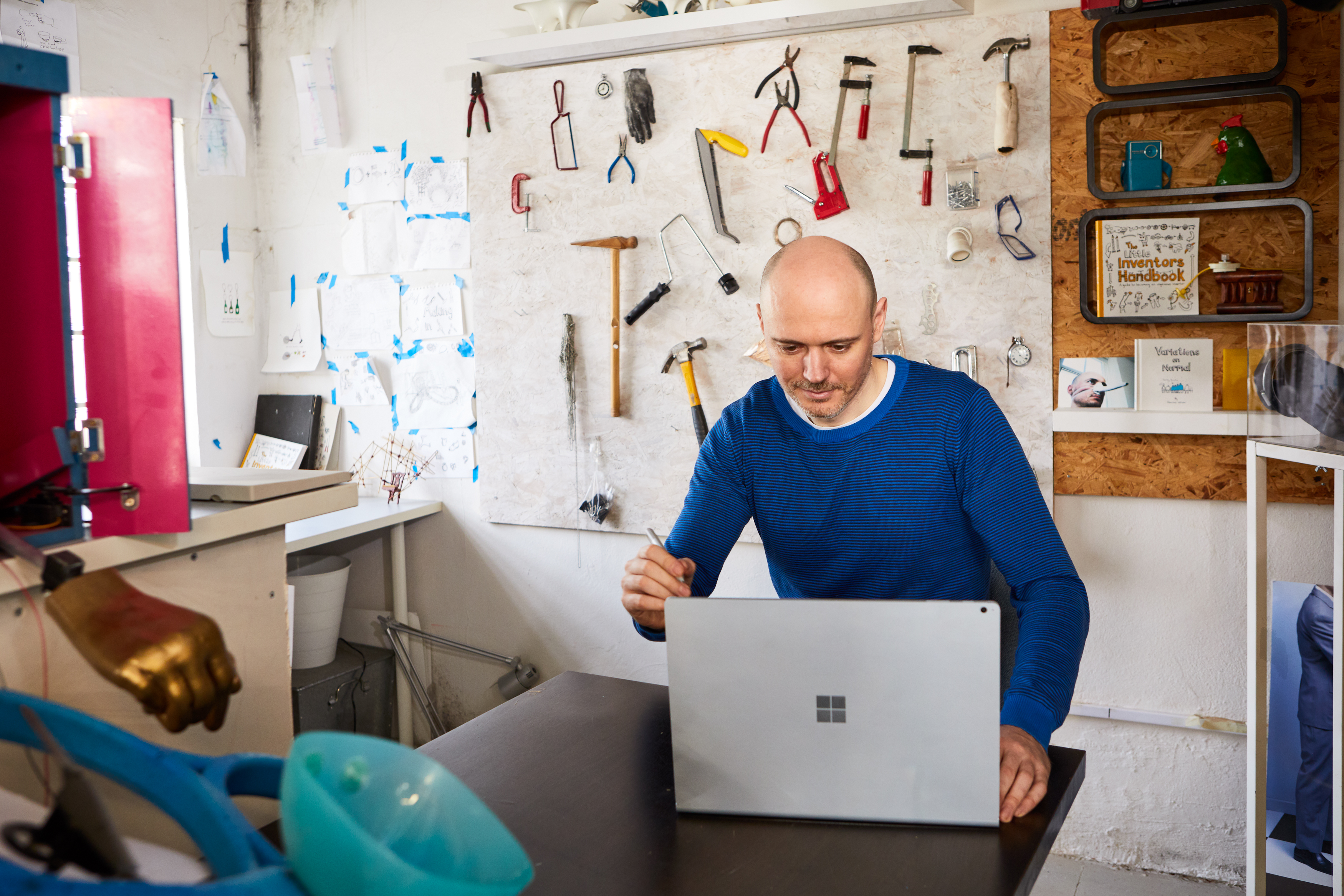 Dominic Wilcox, inventor, works on a Surface Book 2 in his London studio