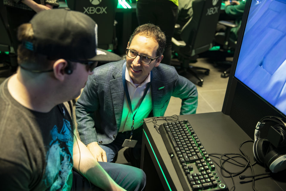 Microsoft CMO Chris Capossela chats to a gamer at the new London Flagship Store