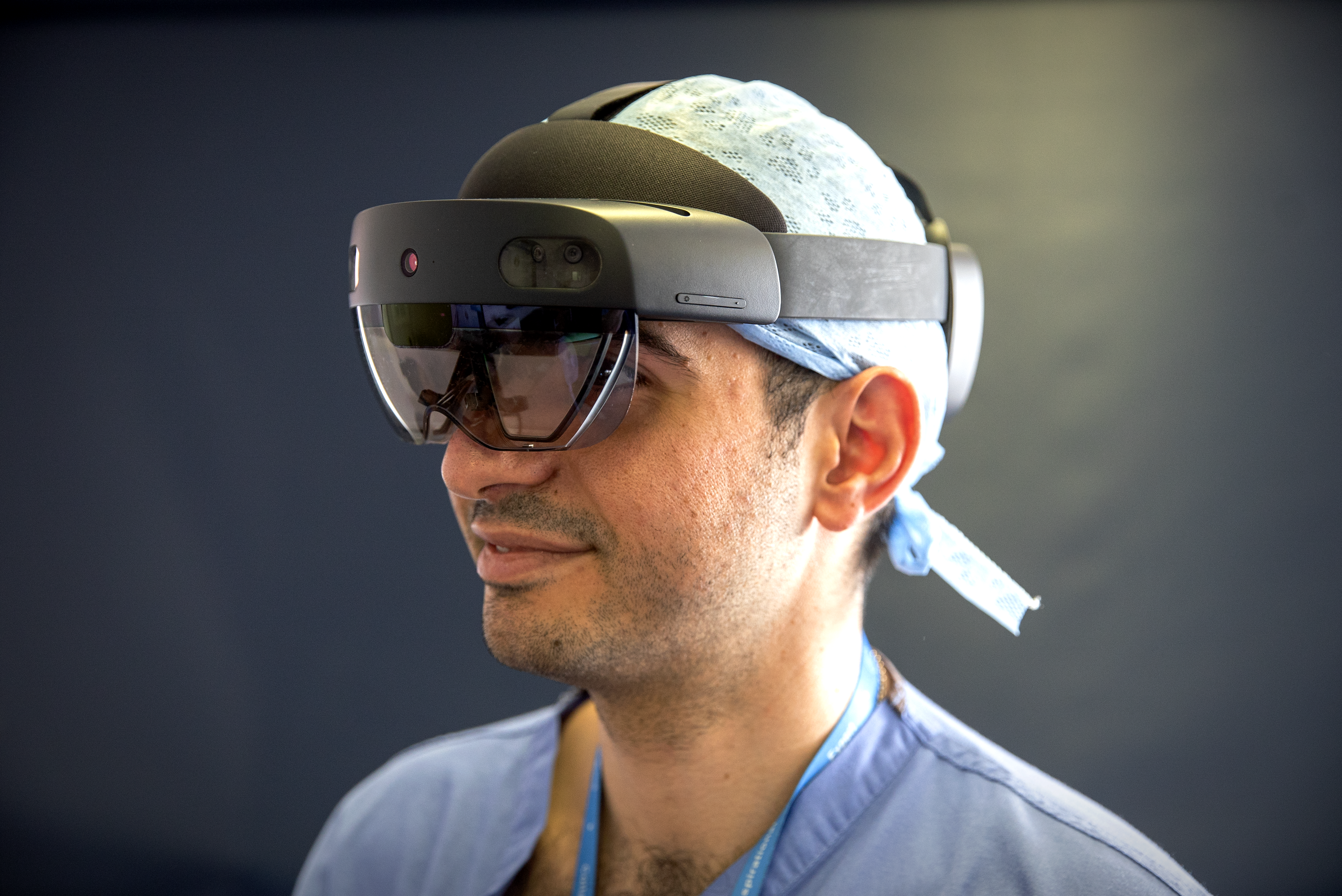 A close-up of an NHS doctor wearing a HoloLens