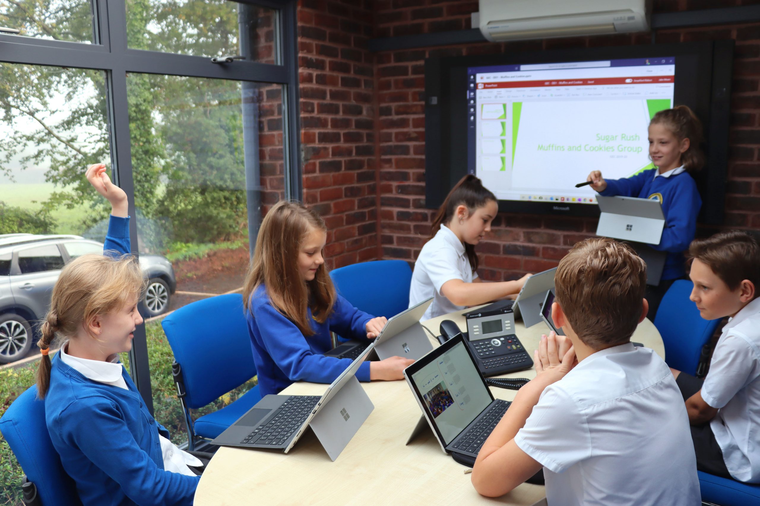 Pupils using laptops in a classroom