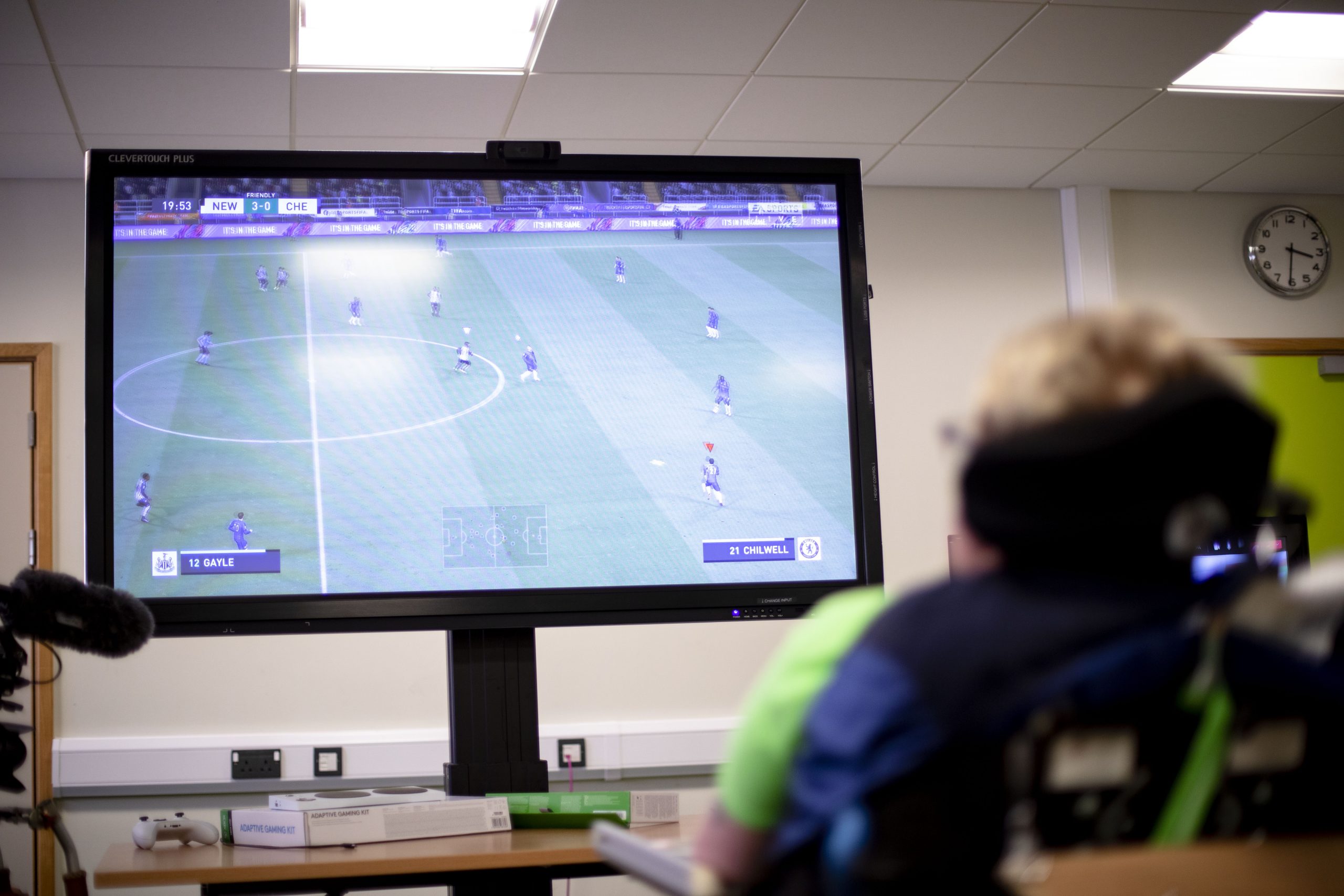 A student at National Star plays FIFA on an Xbox