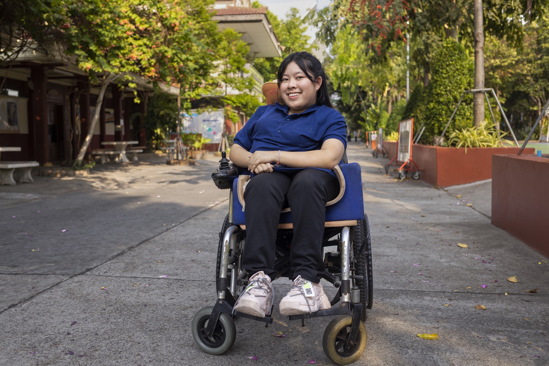 Woman in a wheelchair, smiling