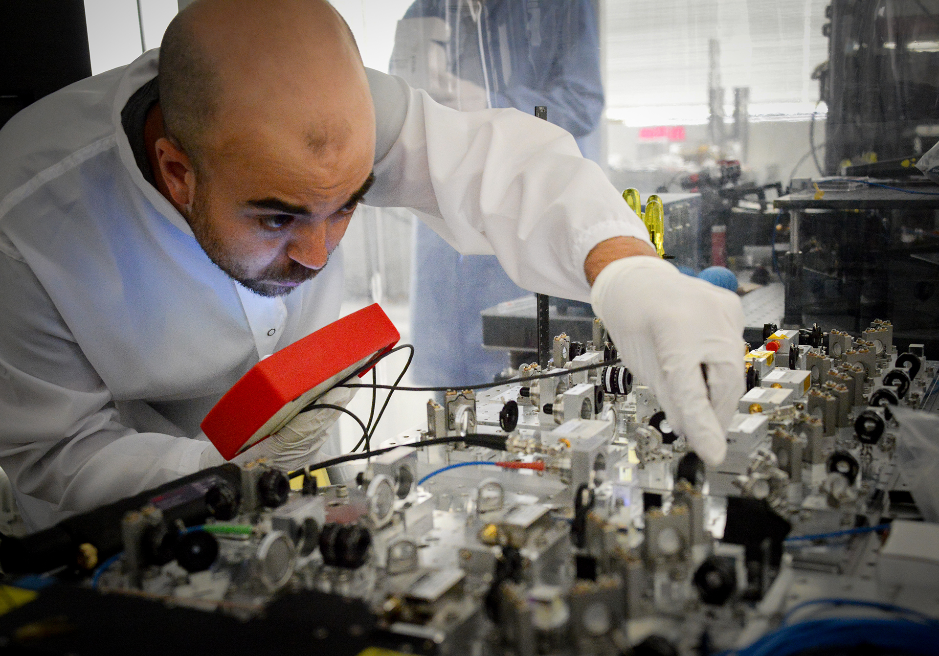 A researcher checks the optics of Atom Computing's next generation quantum system.