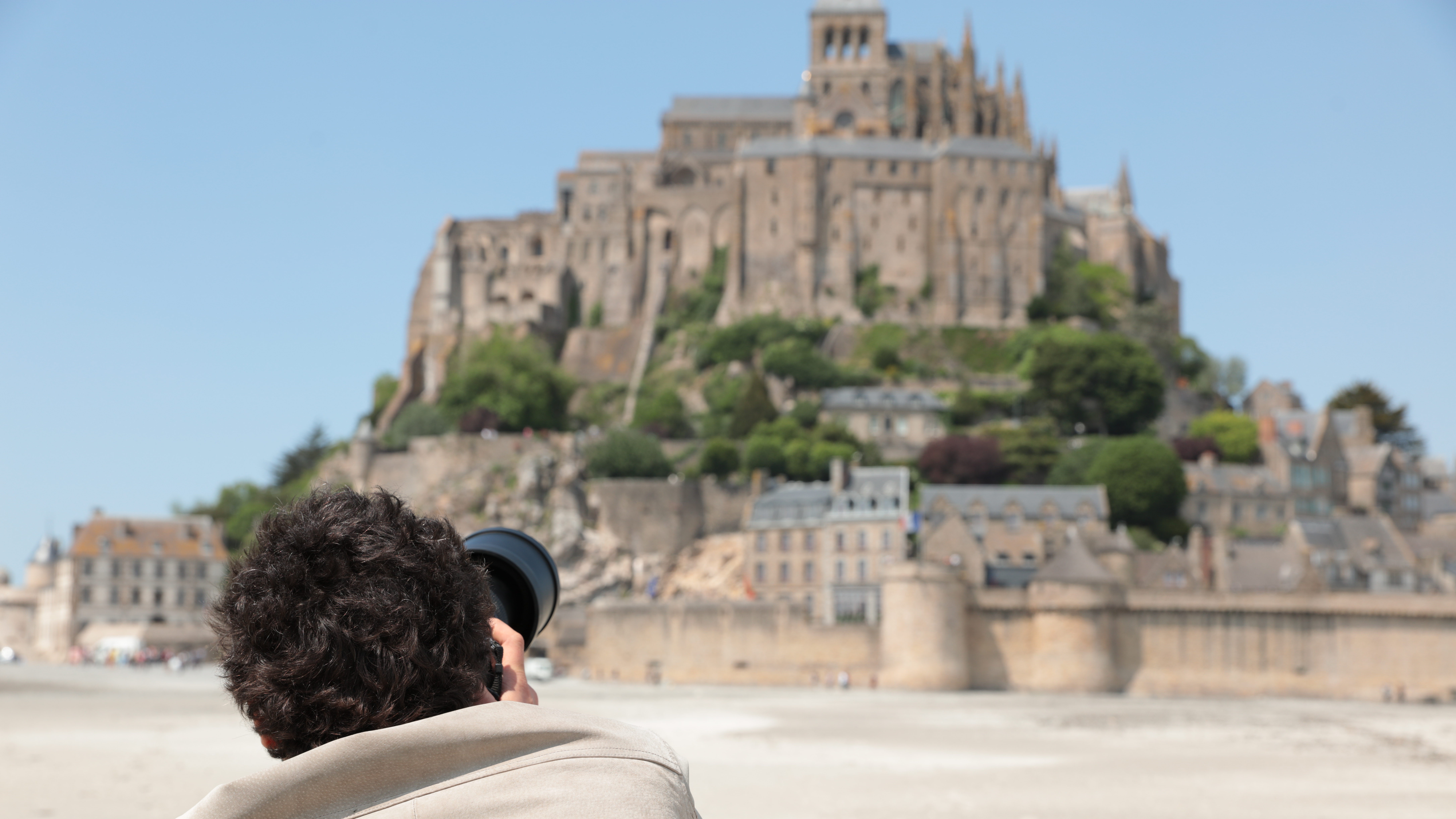 Photographer shooting the island of Mont Saint Michel