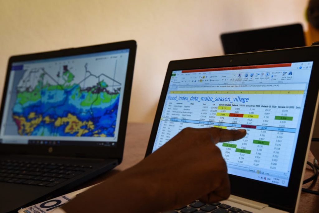 Mariam Doumbia, former country director and head of operations of Oko Mali, shows the maps and satellite data of rainfall in Mali at the start-up's headquarters in Bamako. Photo by Nicolas Réméné.