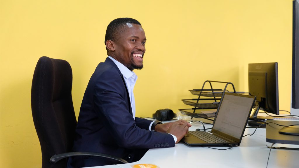 Man at a desk with a laptop