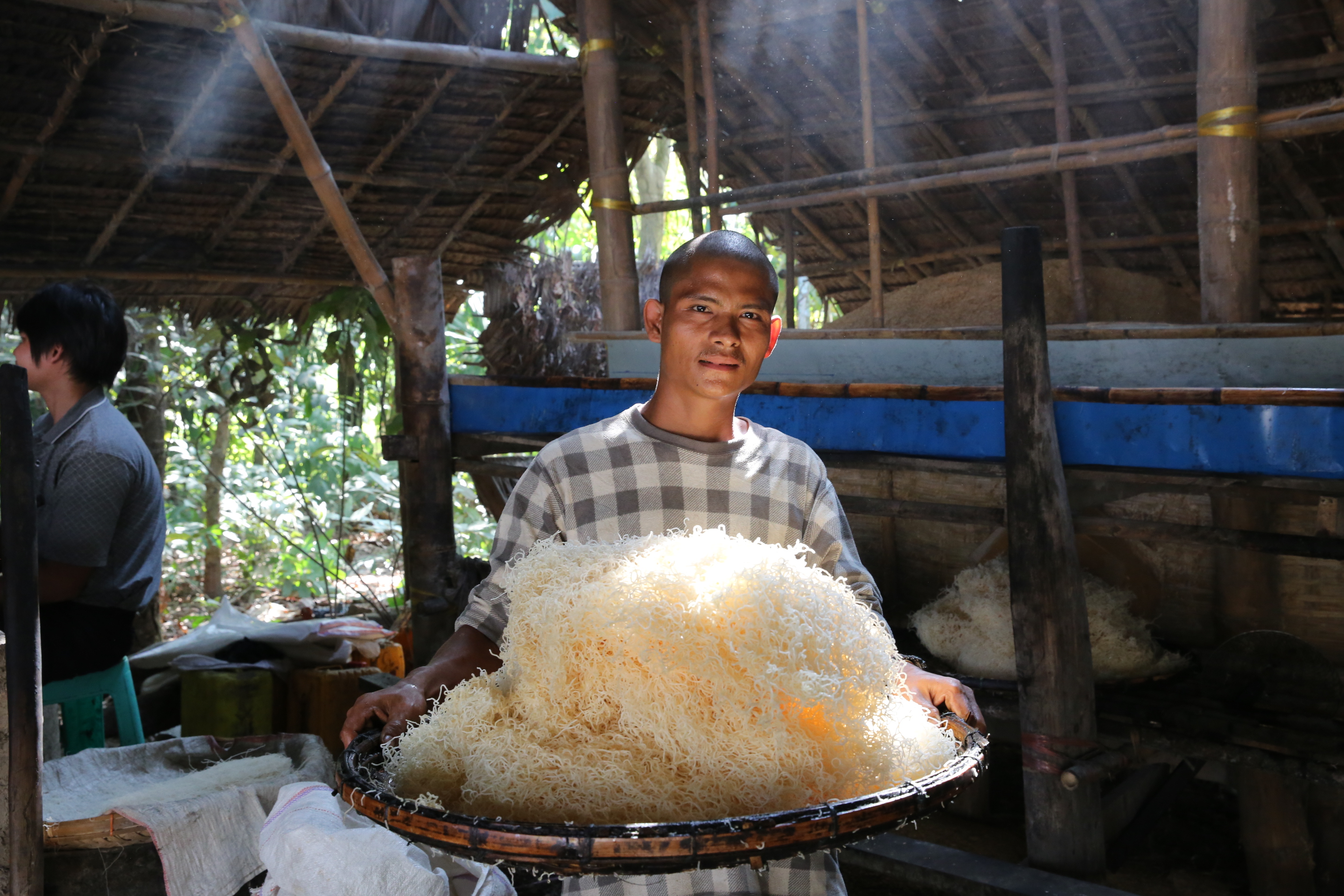 Yar Kode works at the noodle snack factory started in Myanmar by Win Win Soe with the help of a microfinance loan. Such loans can help stimulate local economies in emerging markets.