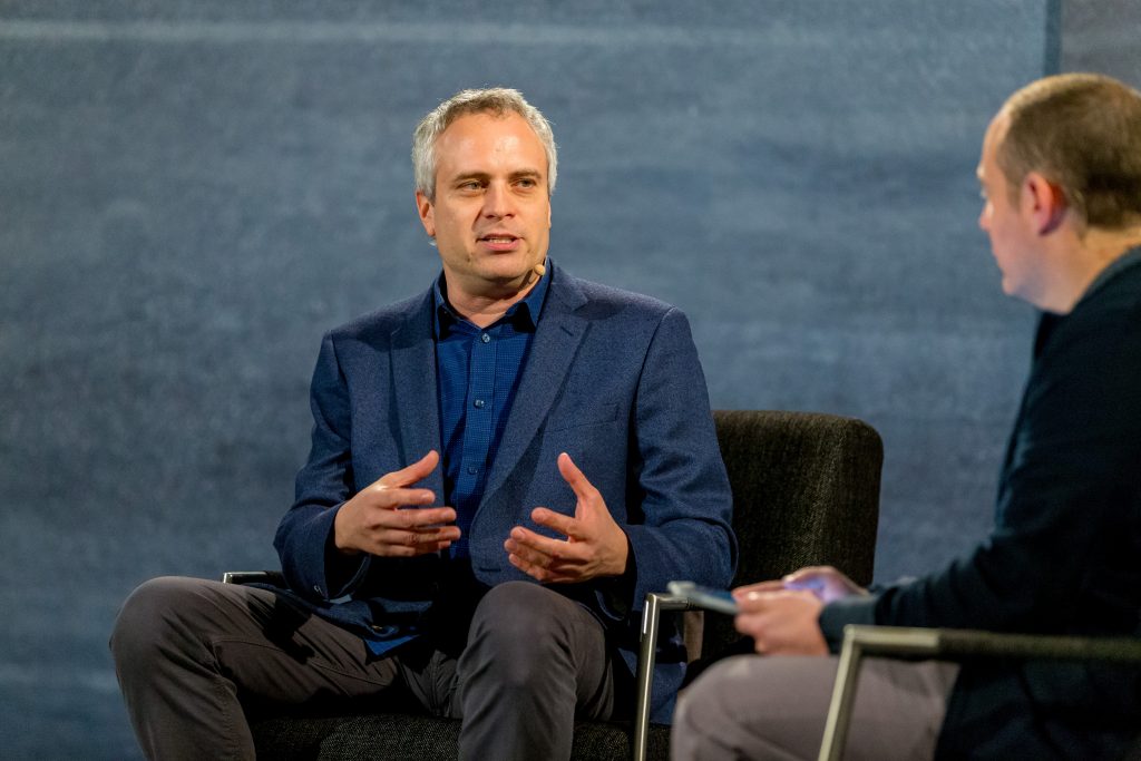 Author and journalist Brad Stone speaks to Microsoft employees, including communications director Rob Wolf, right, as part of the 