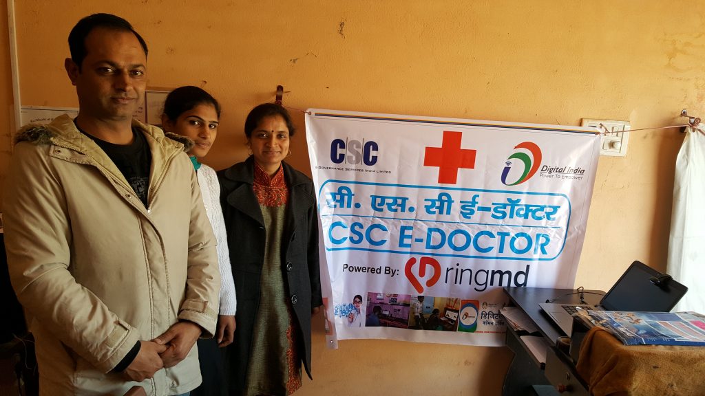 Priyanka Bali, right, with her husband and daughter at the Common Service Centre she operates in her native village. (Photo courtesy of RingMD)