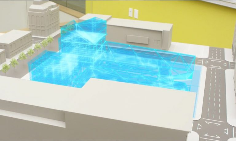 Holographic image is shown on an architectural model
