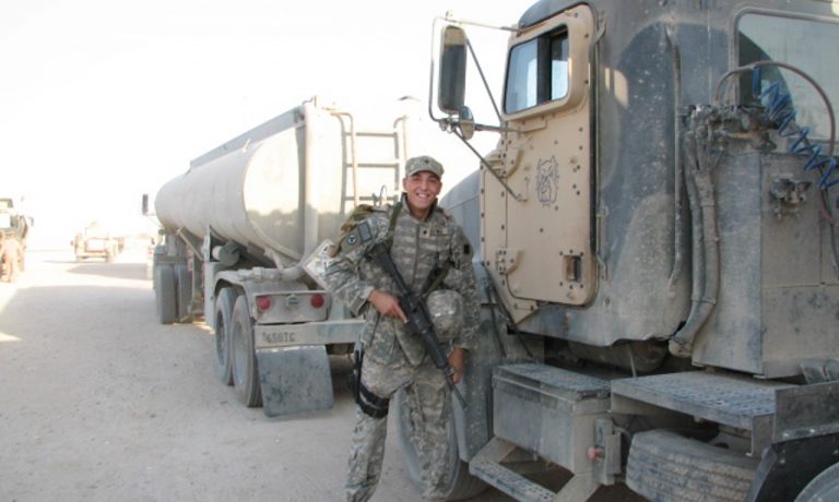 Andrew Weins with his fuel hauler in Iraq.